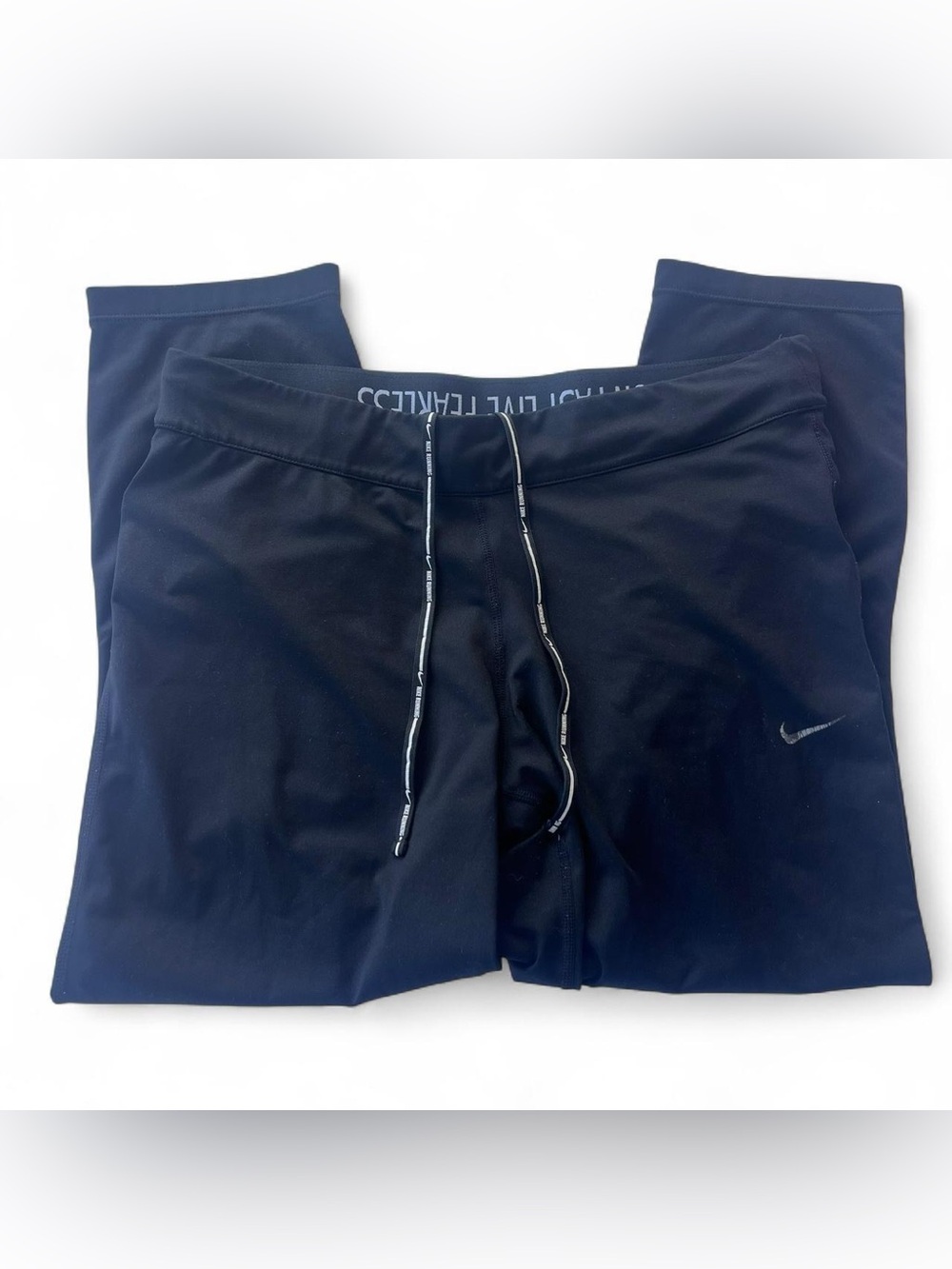 Women’s Nike DriFit running leggings w/ strings and a small pocket